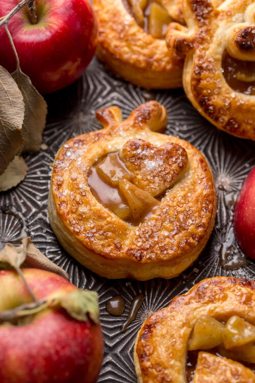 Apple hand pies on a baking sheet.